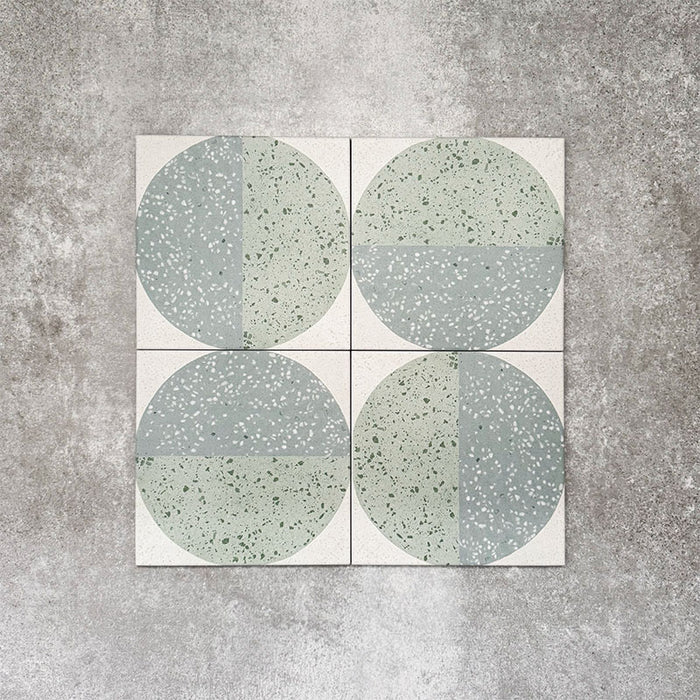 Eclipse Salvia 20x20cm terrazzo-style decor tiles featuring a soft sage and pale blue circular pattern, designed to bring a playful yet calming geometric look to contemporary interiors.