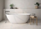 Bathroom interior featuring Etna Marfil Matt 60 × 60cm porcelain wall and floor tiles, styled with a freestanding bath, chrome fittings, and soft neutral tones for a calm, modern, spa-like setting.