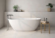 Bathroom interior featuring Etna Marfil Matt 60 × 60cm porcelain wall and floor tiles, styled with a freestanding bath, chrome fittings, and soft neutral tones for a calm, modern, spa-like setting.