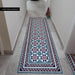 Hallway featuring Farnham Manor Victorian style floor tiles in 20cm x 20cm. Pink, black and green geometric Victorian style tiles create a striking runner bordered with matching decorative tiles, framed by large stone effect porcelain floor tiles for a timeless entrance.