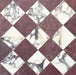 Fayrouz Burgundy Red Tumbled Finish natural marble 15.2cm x 15.2cm tiles laid in a diagonal chequerboard pattern with Fitzrovia Calacatta Viola marble, showcasing striking natural veining, rich colour contrast and timeless elegance.