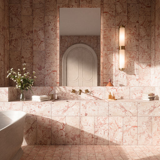 Luxury bathroom featuring Fayrouz Sylvester Pink honed natural marble tiles in 30.5cm x 61cm and matching 15.2cm x 15.2cm floor tiles. Soft pink marble wall and floor tiles with natural veining create an elegant, spa-inspired bathroom with warm brass fixtures.