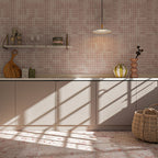 Kitchen featuring Fayrouz Sylvester Pink 30.5cm x 61cm natural marble tiles across the floor, showcasing soft pink tones and distinctive natural veining, paired with pink Moroccan style patterned wall tiles, neutral cabinetry and a marble worktop.