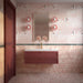 Bathroom featuring Fayrouz Sylvester Pink Honed Finish natural marble 15.2cm x 15.2cm wall and floor tiles, paired with a blush pink vanity, brass tap, decorative wallpaper and soft pink lighting.