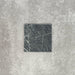 Close-up of Fayrouz Verde tumbled natural marble tiles in a 15.2cm x 15.2cm format, showcasing rich deep green tones, striking white veining and authentic stone variation with a beautifully aged tumbled finish.