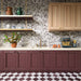 Kitchen featuring Fayrouz White and Fayrouz Burgundy Tumbled Finish natural marble 15.2cm x 15.2cm chequerboard floor tiles, paired with a marble splashback, burgundy cabinetry, oak cupboards and brushed brass fixtures.