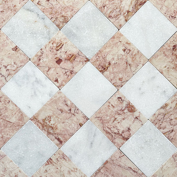 Fayrouz White Tumbled Finish natural marble 15.2cm x 15.2cm tiles laid in a diagonal chequerboard pattern with Fayrouz Sylvester Pink marble, showcasing natural veining, tonal variation and timeless character.