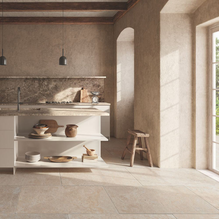 Kitchen interior featuring Flagstone Beige Tumbled Travertine 50 × 100cm porcelain floor tiles, styled with warm plaster-effect walls, rustic wood accents, and soft natural light for a relaxed, Mediterranean-inspired feel.