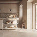 Kitchen interior featuring Flagstone Beige Tumbled Travertine 50 × 100cm porcelain floor tiles, styled with warm plaster-effect walls, rustic wood accents, and soft natural light for a relaxed, Mediterranean-inspired feel.