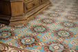 Interior floor setting featuring London Streets Hanover Square 20x20cm Victorian Moroccan style floor tiles, showcasing the repeating blue, terracotta and cream geometric pattern, styled alongside a traditional wooden cabinet for a classic decorative floor design.