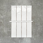 Foundry Arctic White 1.5x30cm gloss pencil bullnose border tile featuring a handcrafted-style finish with soft tonal variation, designed to complement contemporary wall tile layouts and decorative edging details.
