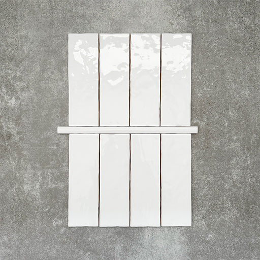 Foundry Arctic White 1.5x30cm gloss pencil bullnose border tile featuring a handcrafted-style finish with soft tonal variation, designed to complement contemporary wall tile layouts and decorative edging details.