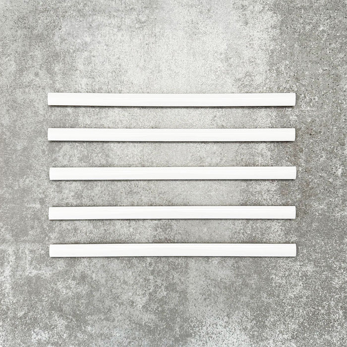 Foundry Arctic White 1.5x30cm gloss pencil bullnose border tiles with a handcrafted-style finish and soft white glaze, designed for decorative edging, borders, and finishing details in contemporary wall tile installations.