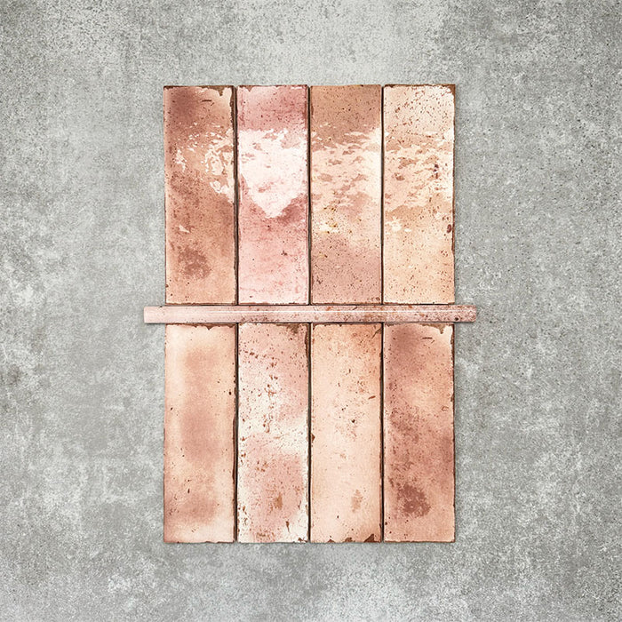 Foundry Coral Pink 1.5x30cm gloss pencil bullnose border tile featuring a handcrafted-style finish with warm blush and terracotta tones, designed for decorative edging and refined finishing details in wall tile installations.