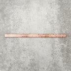 Foundry Coral Pink 1.5x30cm gloss pencil bullnose border tile featuring a handcrafted-style finish with warm blush and terracotta tones, designed for decorative edging and refined finishing details in wall tile installations.