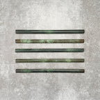 Foundry Jade Green 1.5x30cm gloss pencil bullnose border tile featuring a handcrafted-style finish with rich green tonal variation, designed for decorative edging and refined finishing details in contemporary wall tile installations.