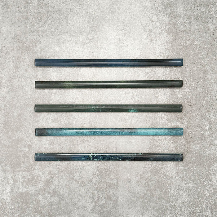 Foundry Marine Blue 1.5x30cm pencil bullnose border tile featuring a handcrafted-style finish with deep blue and teal tonal variation, designed for decorative edging and finishing details in contemporary wall tile installations.