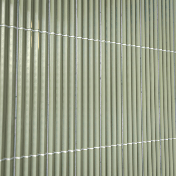 Close-up of Gallery 3D Fluted Decor Tansy Green Gloss 5cm x 20cm wall tiles, showcasing the raised fluted texture, soft green tone, glossy finish and subtle surface variation.
