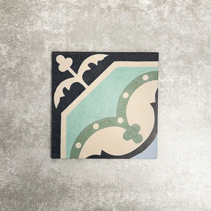 Single London Streets Goodwin Court 20x20cm Victorian Moroccan style porcelain tile displayed in a product setting, featuring an elegant geometric motif in soft blue, cream and charcoal tones inspired by traditional Victorian decorative floor tiles.