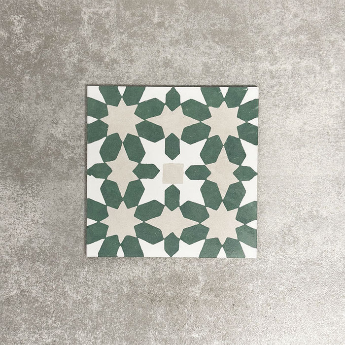 Souk Green C 20×20cm Moroccan-style porcelain tile with a green, white and beige geometric pattern.