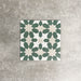 Souk Green C 20×20cm Moroccan-style porcelain tile with a green, white and beige geometric pattern.