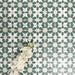 Souk Green C 20×20cm Moroccan-style porcelain tiles arranged in a green, white and beige geometric pattern.