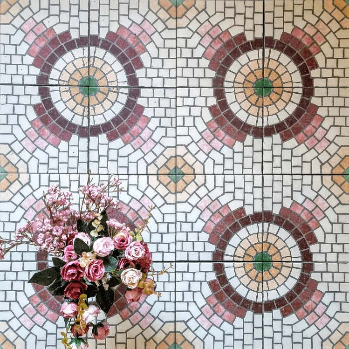 Cuba La Calle Moroccan-style porcelain tiles in a 20×20cm square format, arranged in a repeating circular mosaic-style pattern with soft white, terracotta, burgundy and green tones, styled with floral accents to highlight the tile’s intricate detailing and vintage encaustic-style design.