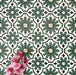 Clara Verde Victorian Moroccan-style porcelain floor tiles in a 20 × 20cm format, laid in a repeating pattern to highlight the bold green geometric design with decorative styling accents.