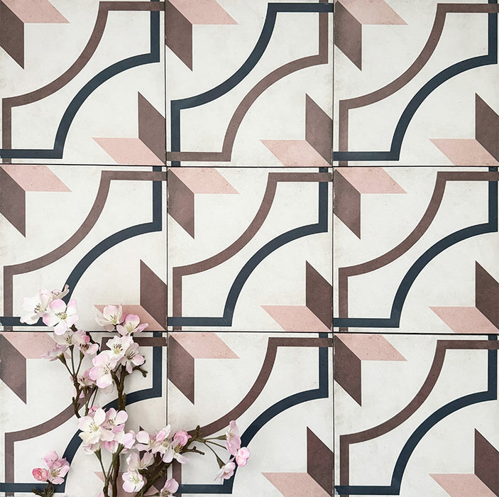 Viscount Rose 20×20cm Victorian-style porcelain wall and floor tiles laid in a repeating geometric pattern with curved lines and angular motifs in soft rose, warm brown and deep navy, shown as a full tile layout with subtle tonal variation and floral styling.