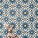 Clara Azul Victorian Moroccan-style porcelain tiles in a 20 × 20cm format, laid in a repeating pattern to showcase the blue and white geometric design across the surface.