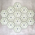 Grouped layout of Medina Soft Green Moroccan-style hexagon porcelain tiles, 18.7 × 21.6 cm, displaying the full repeating geometric pattern in soft green and white tones on a neutral background.