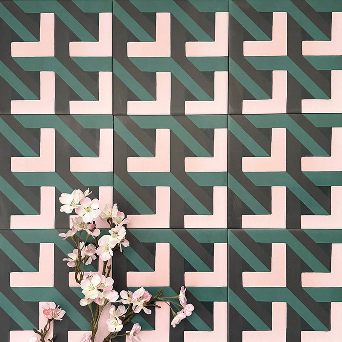 Abstract Lagoon Patterned Tiles in a 20x20cm format, displayed in a repeated grid layout to highlight the bold geometric zigzag design. Deep teal, soft pink and charcoal tones create a striking, contemporary pattern, styled with floral accents to showcase the tiles as a decorative feature suitable for walls, floors or splashbacks.