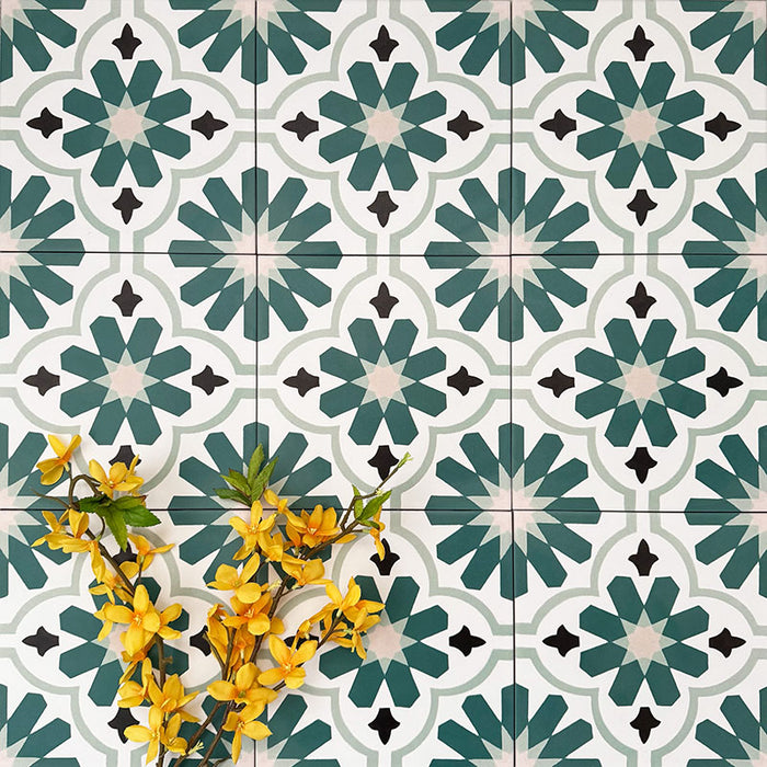 Clara Teal Victorian Moroccan-style porcelain tiles in a 20 × 20cm format, laid in a repeating pattern to showcase the teal and green geometric design across the surface.