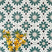 Clara Teal Victorian Moroccan-style porcelain tiles in a 20 × 20cm format, laid in a repeating pattern to showcase the teal and green geometric design across the surface.