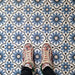 Clara Azul Victorian Moroccan-style porcelain tiles in a 20 × 20cm format, laid in a repeating pattern to showcase the blue and white geometric design across the surface.