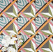 Cuba Star Moroccan-style porcelain tiles in a 20×20cm square format, arranged in a repeating geometric star pattern in soft green, blue, pink and mustard tones, shown from above to highlight the tile’s bold symmetry, crisp lines and decorative encaustic-style design.