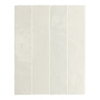 Bora Bora White Sand Brick ceramic wall tile in a 6.5 × 32.8cm slim brick format, featuring a soft white sand tone and a flux glaze finish with subtle surface variation, shown as a single tile on a white background.