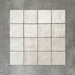 Zellige Oyster Square Moroccan-style ceramic tiles in a 10 × 10cm format, shown in a grouped layout highlighting the soft oyster-white glaze and subtle handmade surface variation.