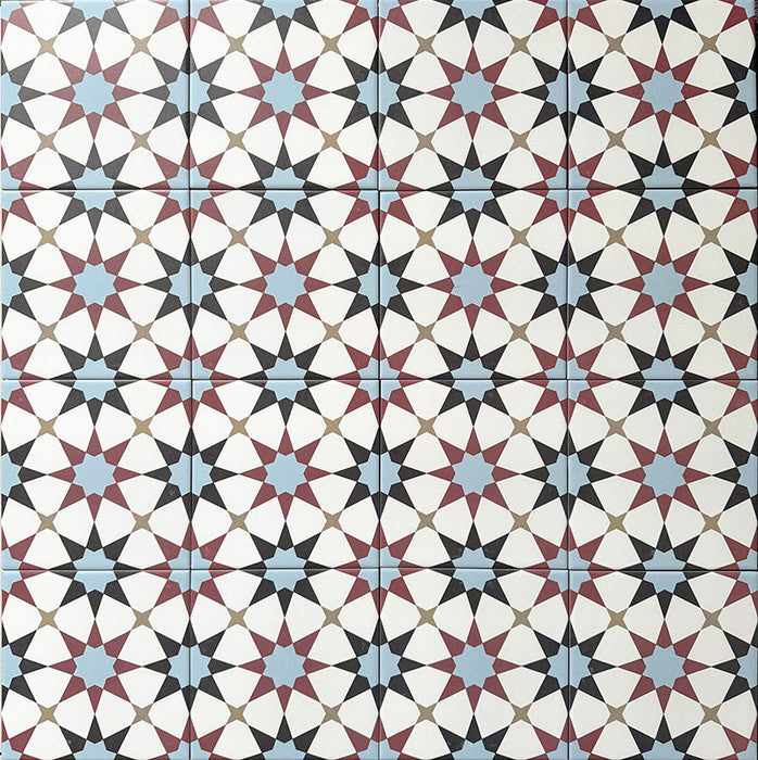 Agadir Atlas Mini Moroccan-style 15x15cm porcelain floor tiles laid in a repeating geometric star pattern, featuring a multicolour palette of soft blue, burgundy, black and cream.