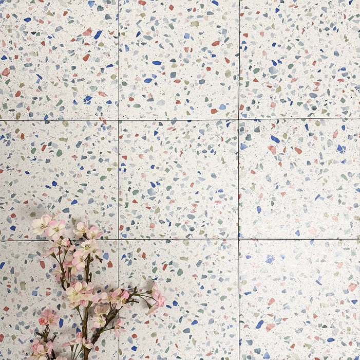 Patterned layout featuring Gelato Tutti Frutti 25x25cm terrazzo-style porcelain tiles, showcasing a light base with evenly scattered multicoloured terrazzo flecks for a fresh, playful and contemporary design.