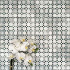 Berber Mequinez Green 15×15cm Moroccan-style porcelain tiles laid in a grid pattern, showcasing a soft green and cream geometric design with decorative floral styling.