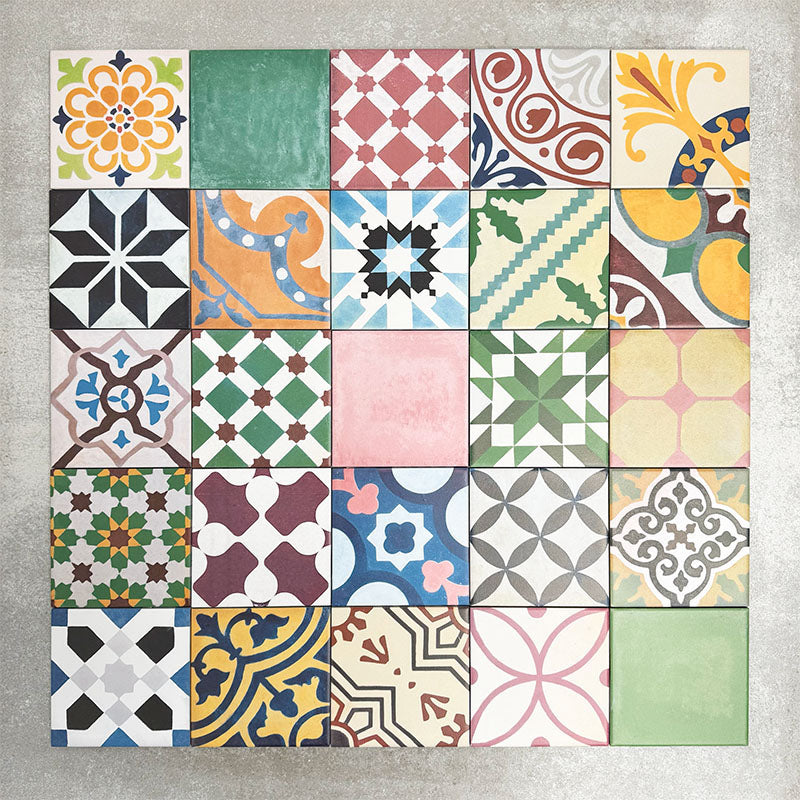 Fayrouz Mini Patchwork 15×15cm Moroccan-style porcelain tiles displayed as a mixed patchwork layout, showcasing a vibrant collection of geometric and floral designs in green, blue, pink, mustard, terracotta and neutral tones.