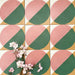 Abstract Pablo Patterned Tiles in a 20x20cm format, shown in a repeated grid layout to highlight the bold geometric circular design. The pattern combines soft pink and deep green tones with warm ochre accents, creating a striking yet balanced look ideal for feature walls, floors or decorative splashbacks.