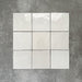Zellige White square Moroccan-style ceramic tiles in a 13.2 × 13.2cm format, shown in a clean grid layout with a softly uneven, glossy finish.