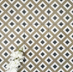 Viscount Park Road 20×20cm Victorian-style porcelain wall and floor tiles laid in a repeating geometric diamond pattern in olive green, white and dark grey, shown as a full tile layout with subtle tonal variation and white floral styling.