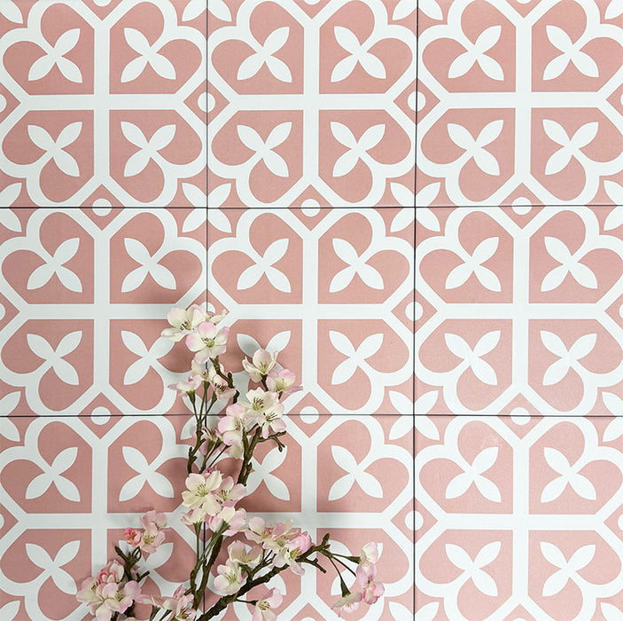 Ivy Rose Victorian Moroccan style 20x20cm patterned tiles, shown in a flat lay with decorative flowers highlighting the soft pink and white geometric design.