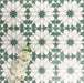 Souk Green D 20×20cm Moroccan-style porcelain tiles arranged in a green, white and beige geometric pattern.