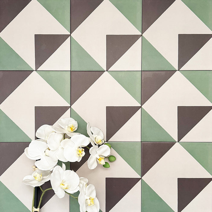 Abstract Angles Patterned Tiles in a 20x20cm format, displayed in a repeated grid layout to showcase the bold angular geometric design. Muted green, deep charcoal and soft cream tones create a clean, contemporary pattern ideal for feature walls, floors or decorative splashbacks.