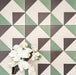 Abstract Angles Patterned Tiles in a 20x20cm format, displayed in a repeated grid layout to showcase the bold angular geometric design. Muted green, deep charcoal and soft cream tones create a clean, contemporary pattern ideal for feature walls, floors or decorative splashbacks.