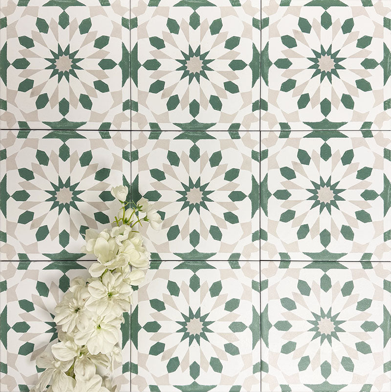 Souk Green A 20×20cm Moroccan-style porcelain tiles arranged in a green, white and beige geometric pattern.